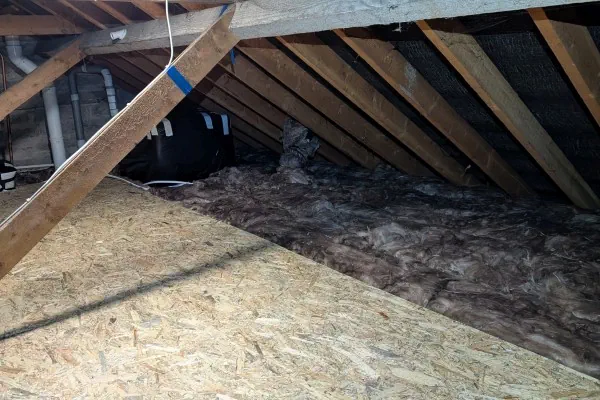 Attic insulation, raised OSB flooring and insulated water tanks installed in an older home in Dublin